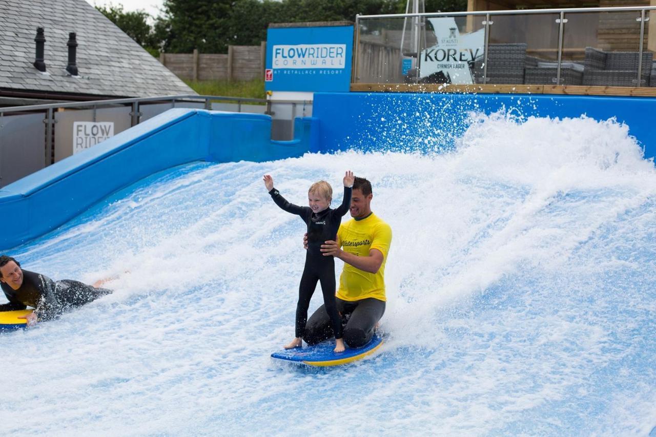 Retallack Resort & Spa Padstow Exterior photo A child learning to surf on the FlowRider